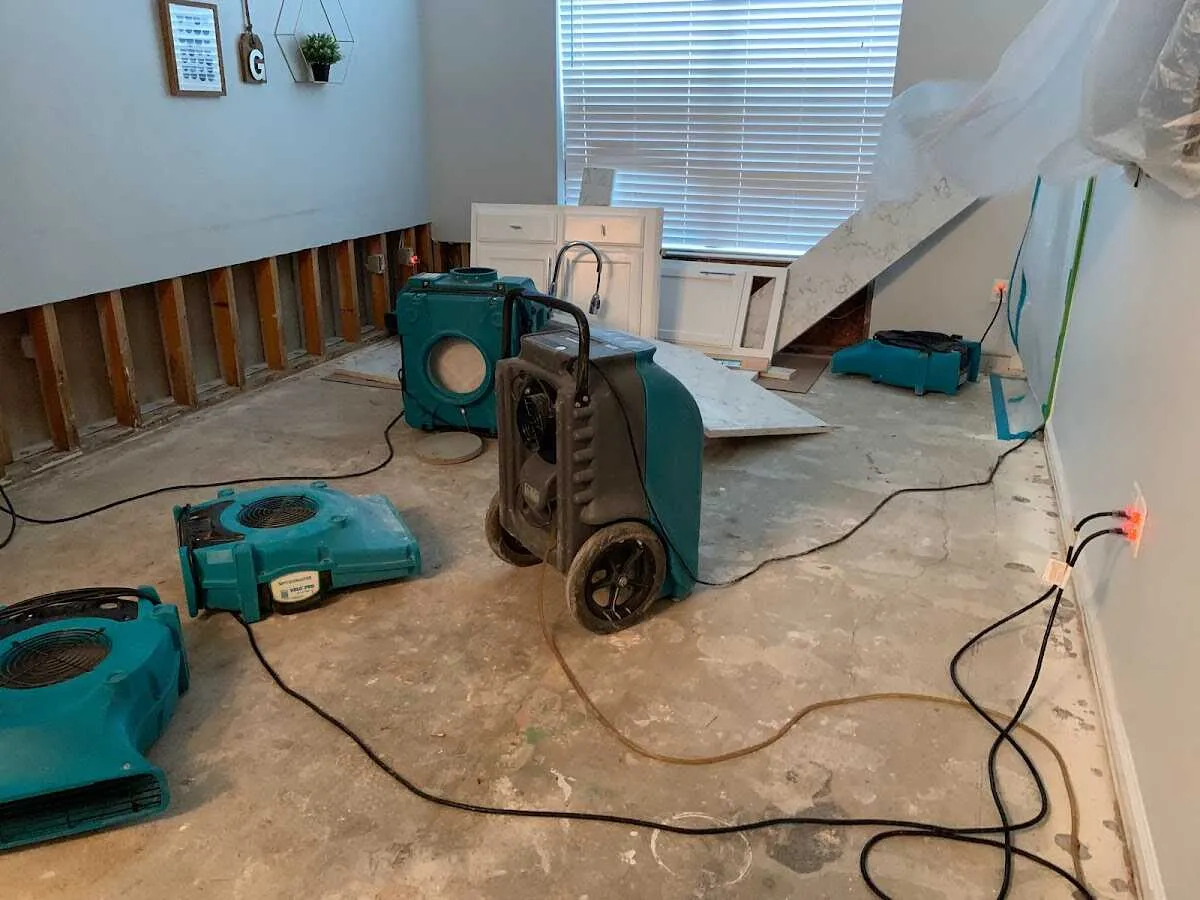 Dehumidifier in flood-cut room for Water Damage Restoration in Ridley